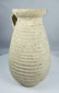 Ancient Roman terracotta pitcher from Africa Proconsularis with ribbed body and flared rim.
