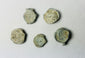 Colonial English copper trade tokens, 18th–19th century, encrusted with marine patina, recovered from shipwreck