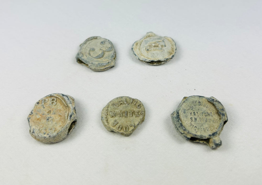Set of five shipwrecked English copper tokens, 18th–19th century, colonial trade and commerce artifacts