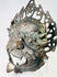 Protective bronze ritual mask from the Himalayan region with remnants of pigment and devotional wear