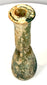 Roman Imperial unguentarium with a pronounced circular rim, narrow bottle opening, and naturally irregular glassblown proportions.