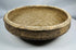 Side profile of a Roman North African pottery bowl illustrating its thickened rim and gently sloping walls.