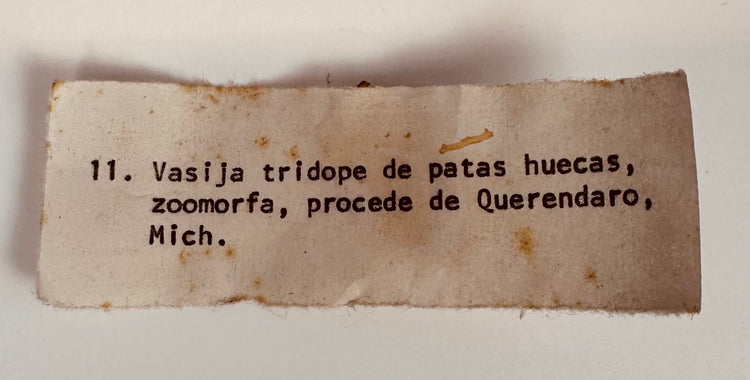 Original collection inventory label identifying the Pre-Columbian zoomorphic tripod vessel from Queréndaro, Michoacán, Mexico.
