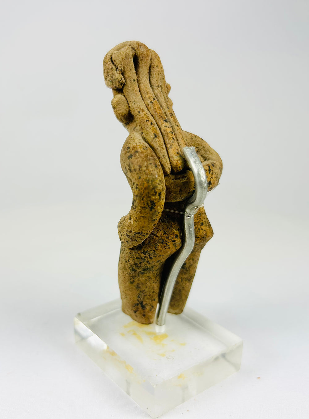 Pre-Columbian West Mexican ceramic figure displaying stylized proportions and ceremonial headdress