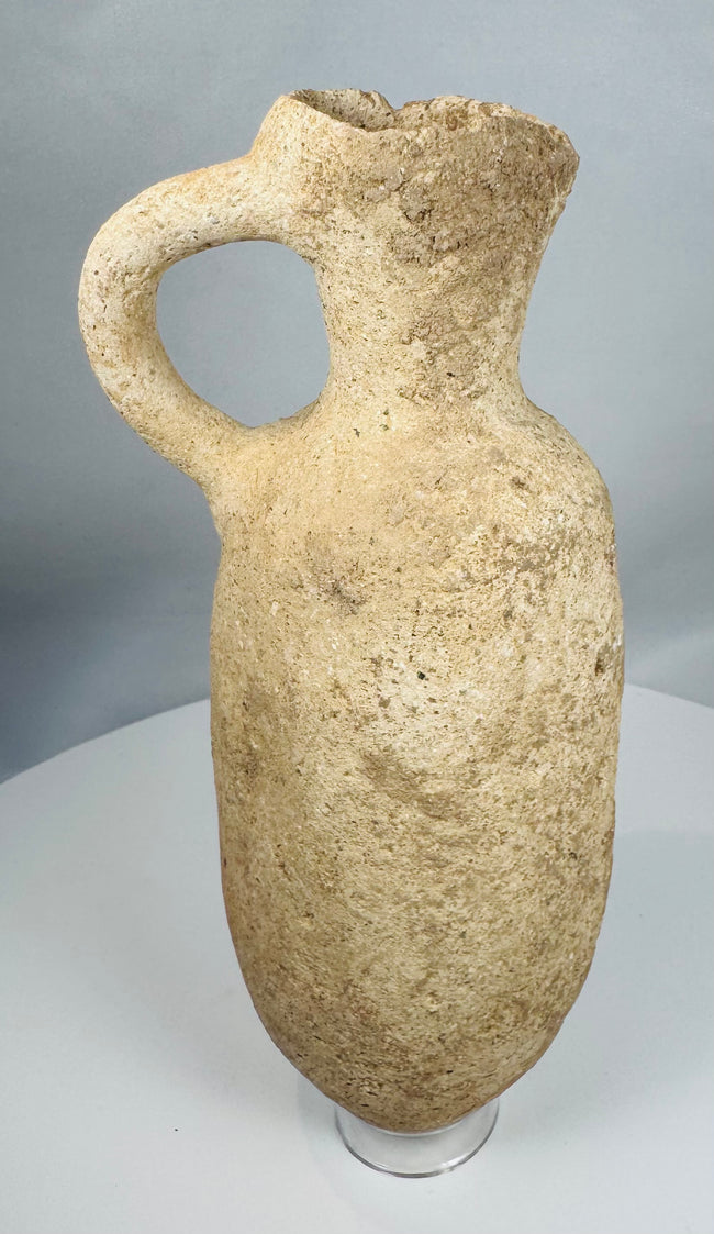 Authentic Roman terracotta storage vessel with a rounded body, loop handle, and weathered archaeological surface.