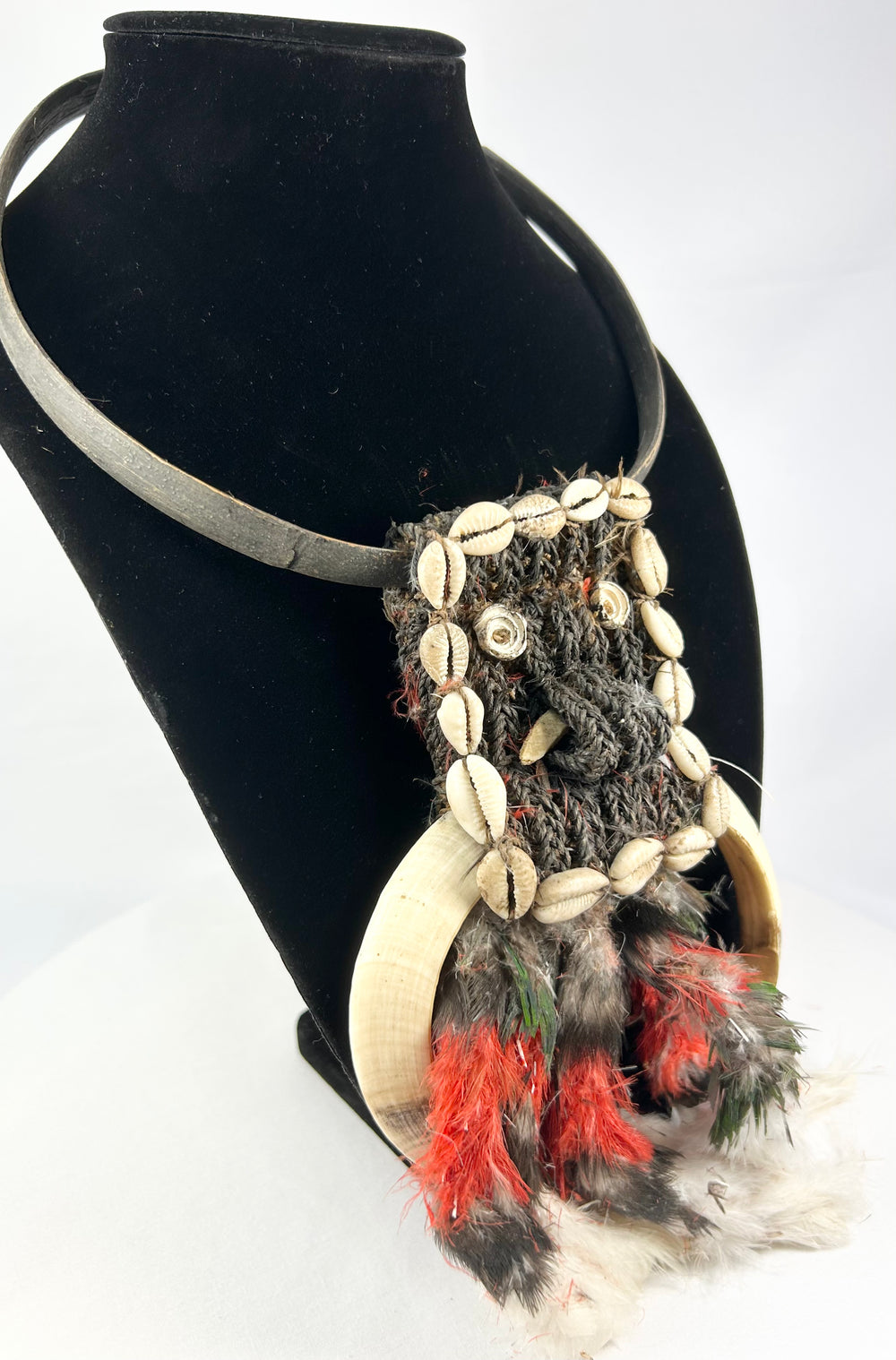Papua New Guinea ceremonial dance necklace mounted on display stand