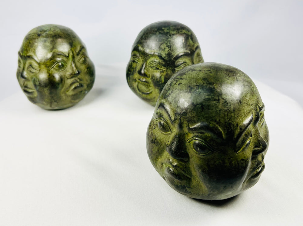 Trio of Buddhist devotional heads crafted in traditional style with aged patina finish