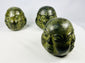 Trio of Buddhist devotional heads crafted in traditional style with aged patina finish