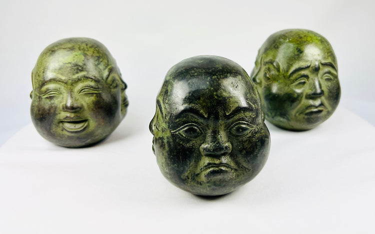 Four Faces of Enlightenment | Patinated Metal Buddha Heads | 20th Century