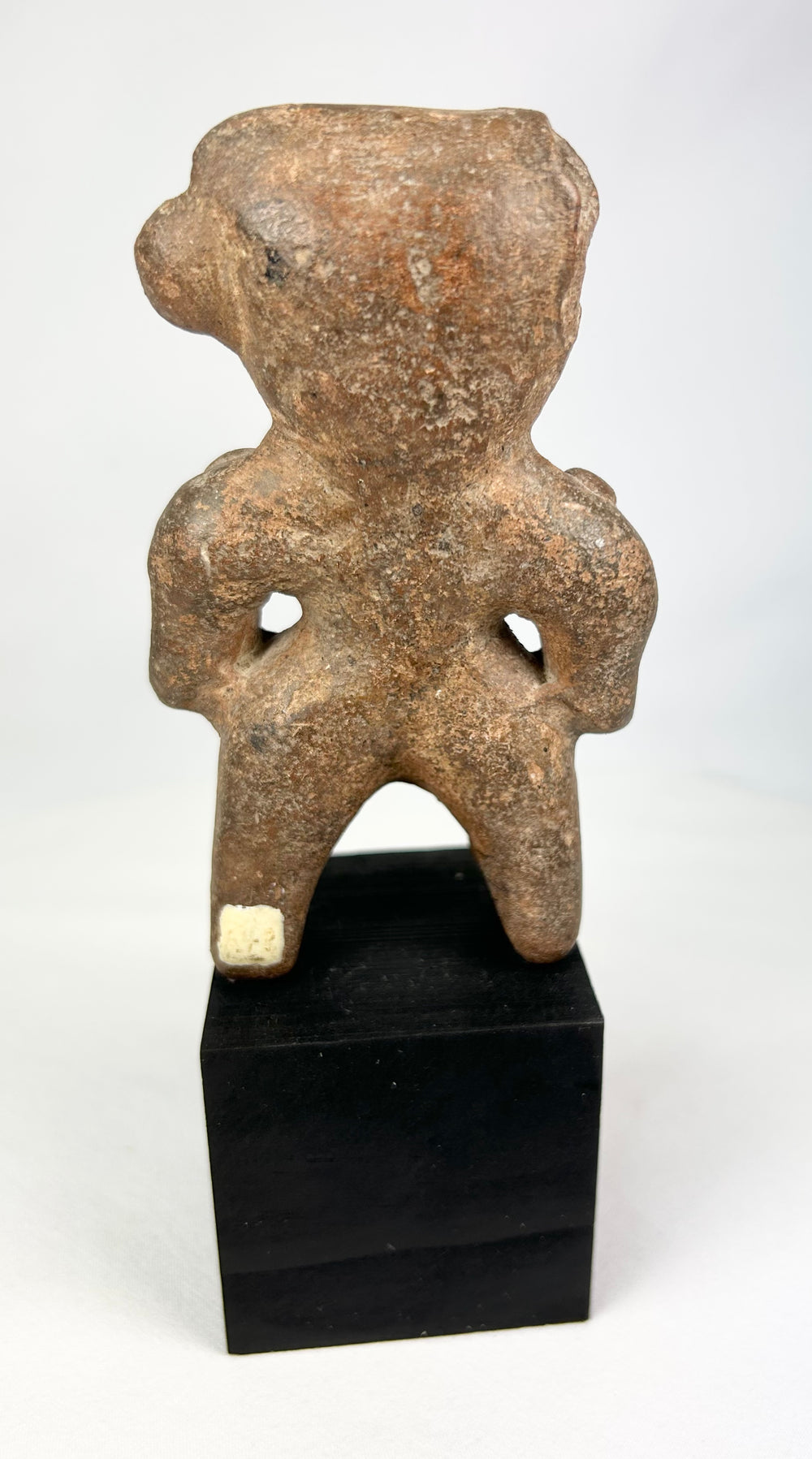 Ancient West Mexico terracotta funerary figure with wide stance and bent arms
