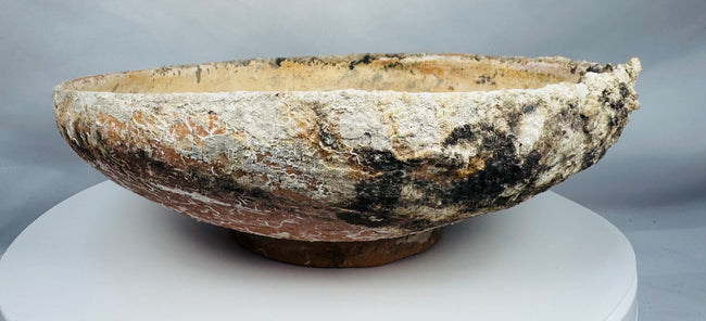 Byzantine ceramic slipware bowl featuring a central medallion motif and concentric decorative bands.