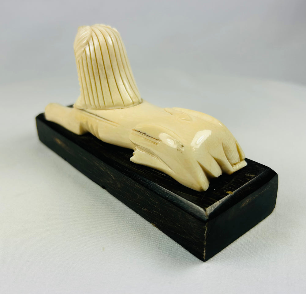 Carved sphinx with lion body and pharaoh head reflecting Western fascination with ancient Egypt