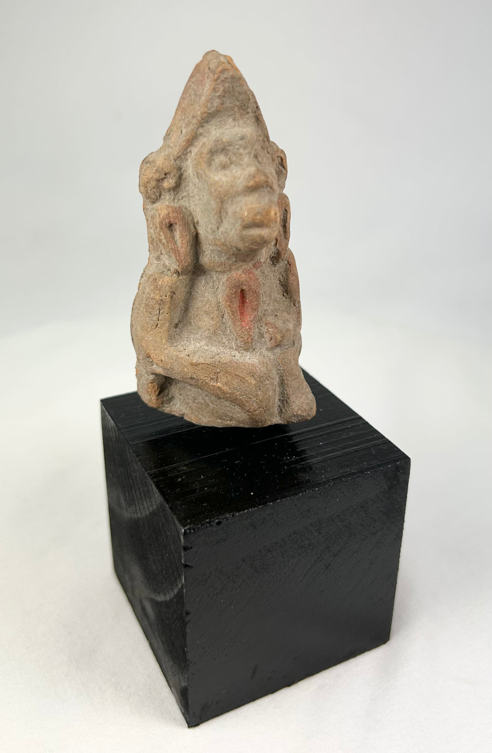 Ancient Northern Indian terracotta votive figure, 3rd–6th century CE, stylized face, traces of original pigment