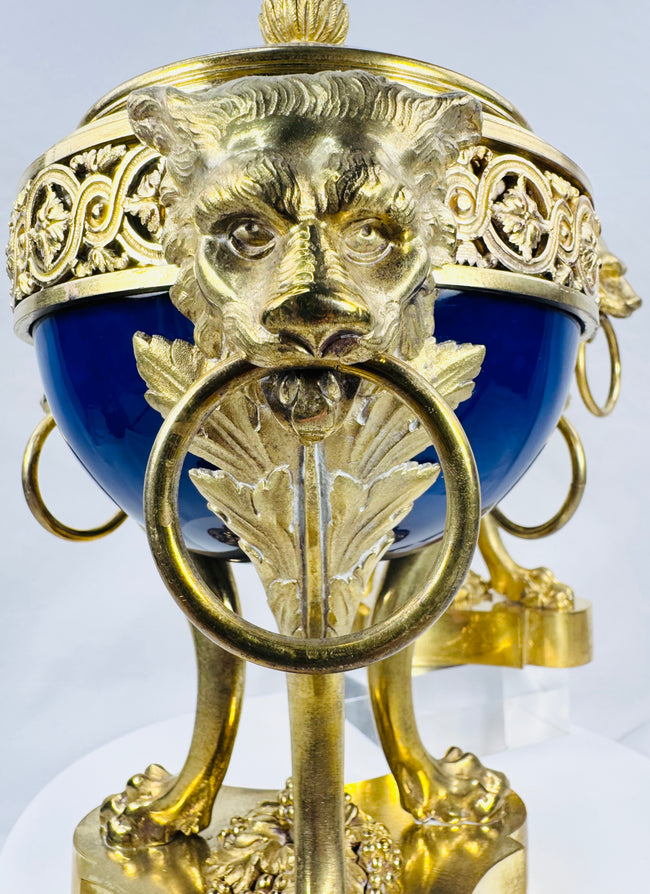 Antique Louis XVI Revival vase showcasing deep cobalt-blue porcelain and ornate gilt bronze detailing.