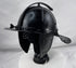 Historic Northern European cavalry helmet with pierced ear guards, adjustable nasal bar, and aged black finish.