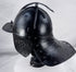 Museum-quality seventeenth-century European armour helmet with fluted skull and original wing-form nasal adjustment screw.