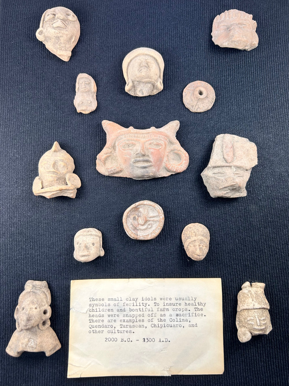 Framed Pre-Columbian artifacts from Teotihuacan and Veracruz traditions