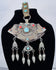 Historic Tibetan Buddhist portable shrine decorated with repoussé floral motifs and turquoise cabochons.