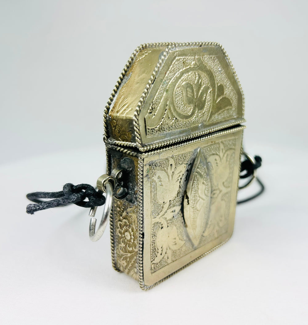 Hinged Tibetan portable shrine with symbolic repoussé decoration