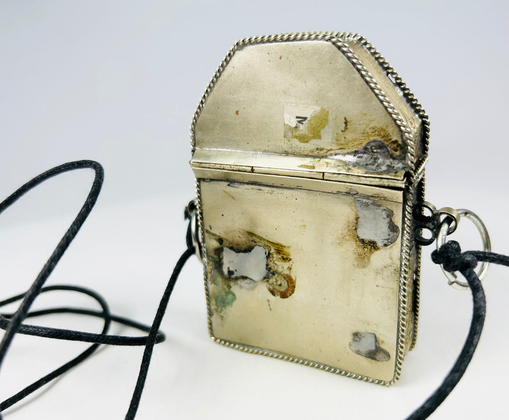 Tibetan devotional travel shrine with detailed silver repoussé work