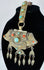 Traditional Tibetan portable shrine ornament with repoussé metalwork, turquoise, coral, and articulated hanging pendants.