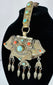 Traditional Tibetan portable shrine ornament with repoussé metalwork, turquoise, coral, and articulated hanging pendants.