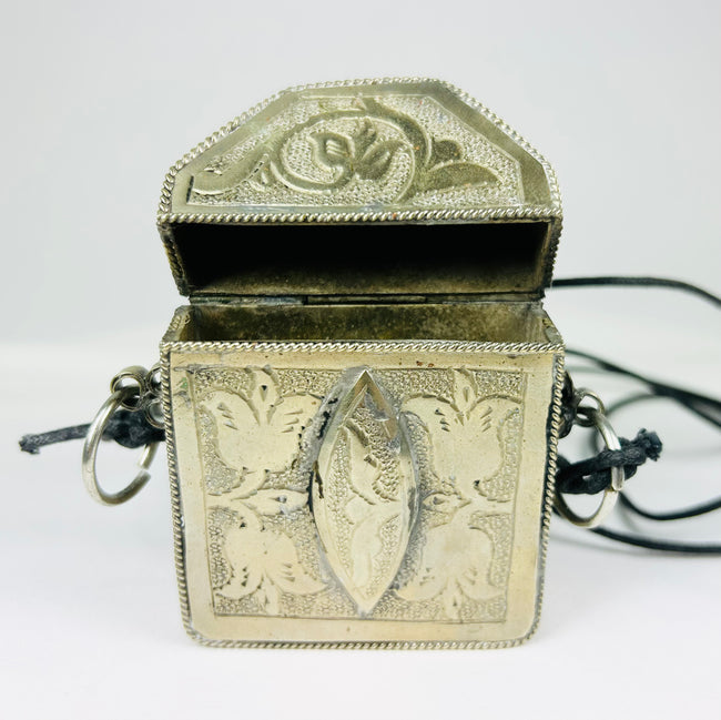 Antique Tibetan wearable altar with floral and symbolic patterns