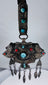 Late 19th century Tibetan ceremonial chest ornament with silvered metal, turquoise, coral, and hanging pendants.