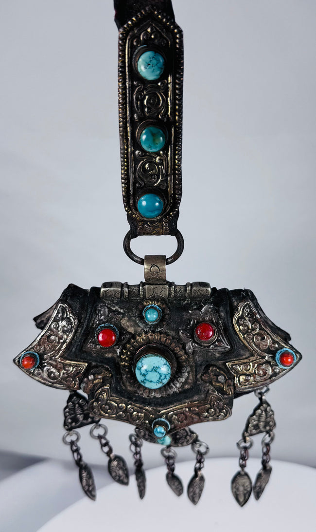 Large Tibetan gau shrine pendant with suspended leaf-shaped drops and decorative turquoise stone settings.