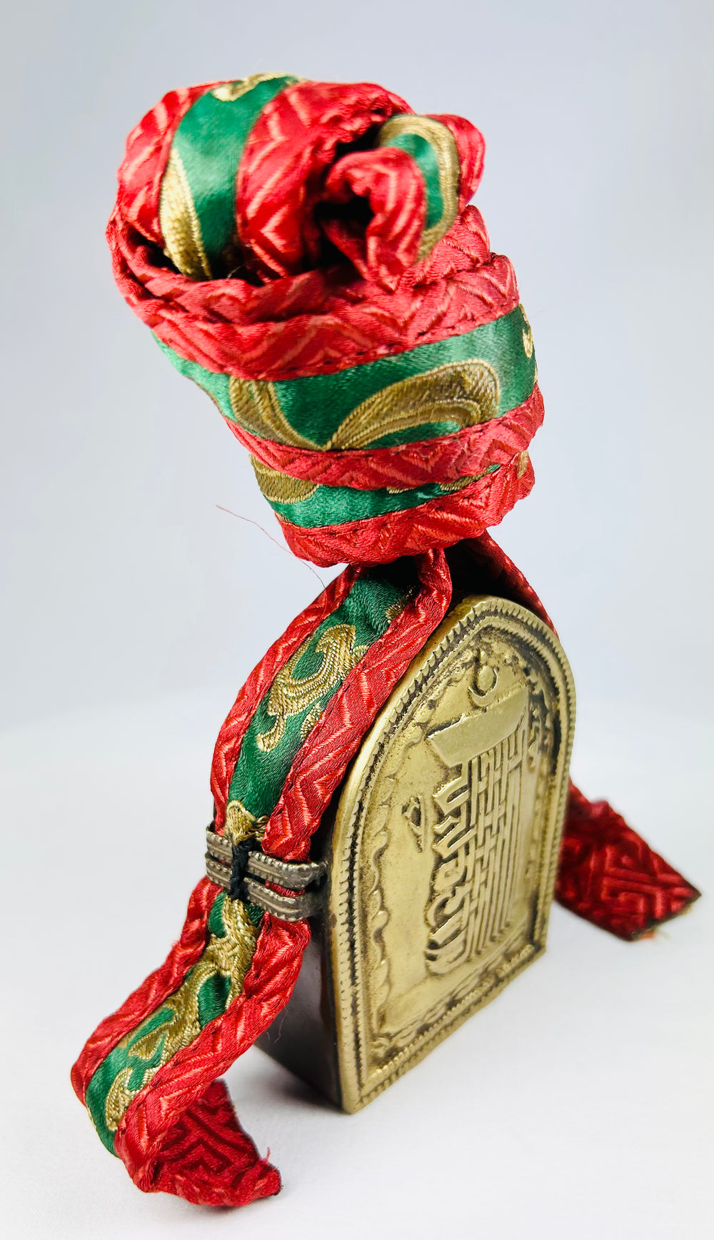 Himalayan Buddhist gau shrine box in brass with repoussé lettering and original textile pouch