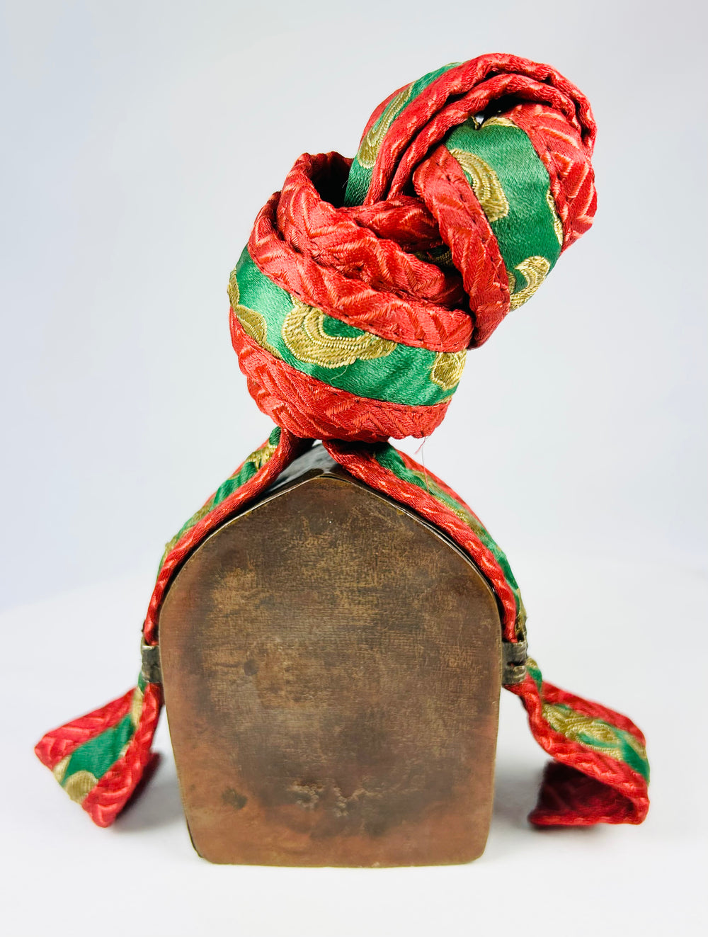 Historic Tibetan gau amulet box, brass shrine with sacred script and original red-green textile cover