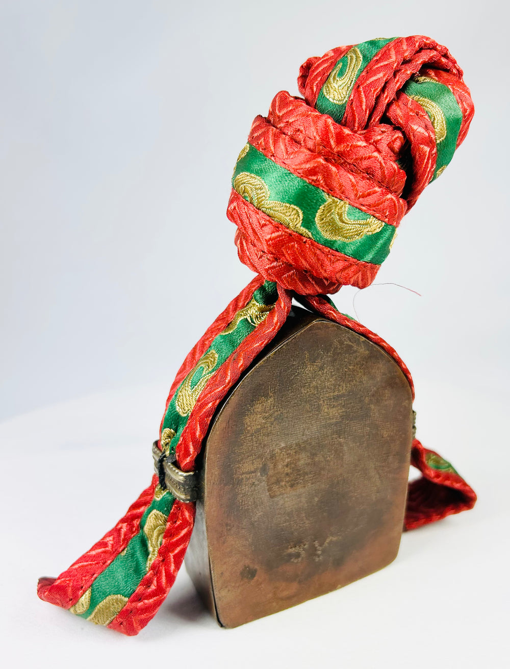 19th century Tibetan gau box with repoussé metalwork and embroidered protective pouch