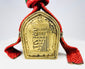 Tibetan gau amulet box shrine, brass with raised script and original woven strap and pouch