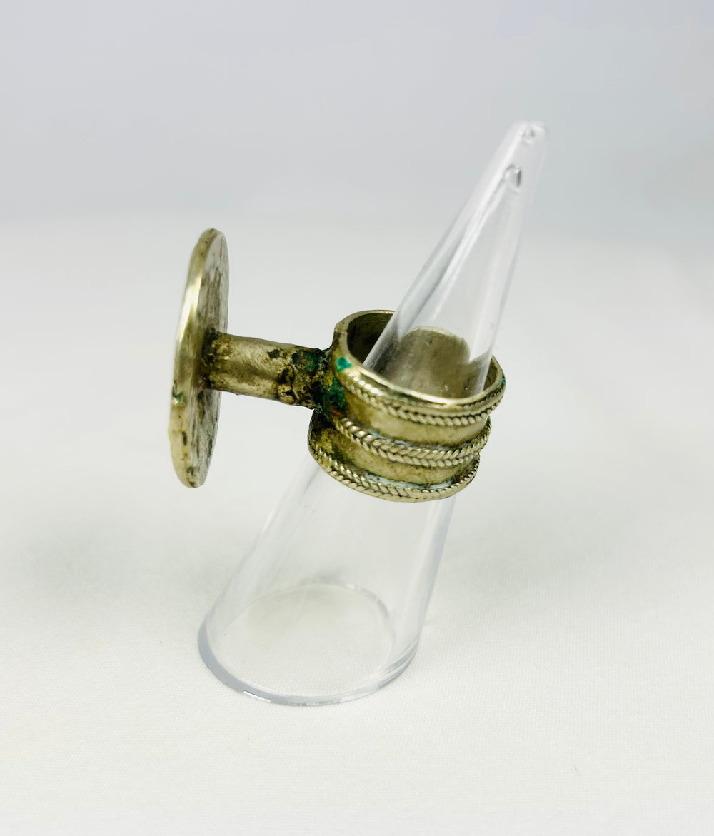 Antique European ring from late 1800s showcasing rosette motif and tapered band.