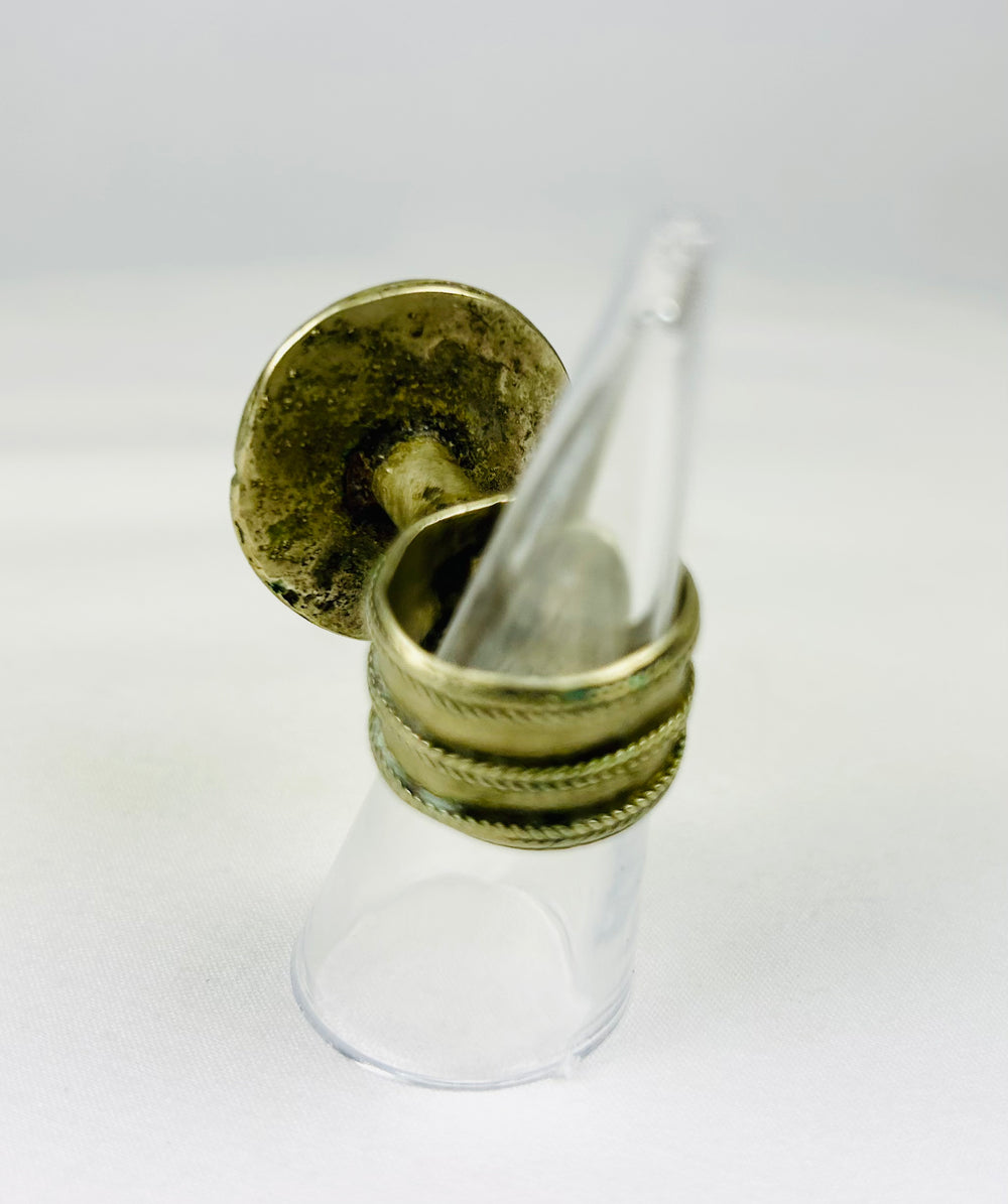 19th century European ring with ornate raised rosette and classic tapered band.