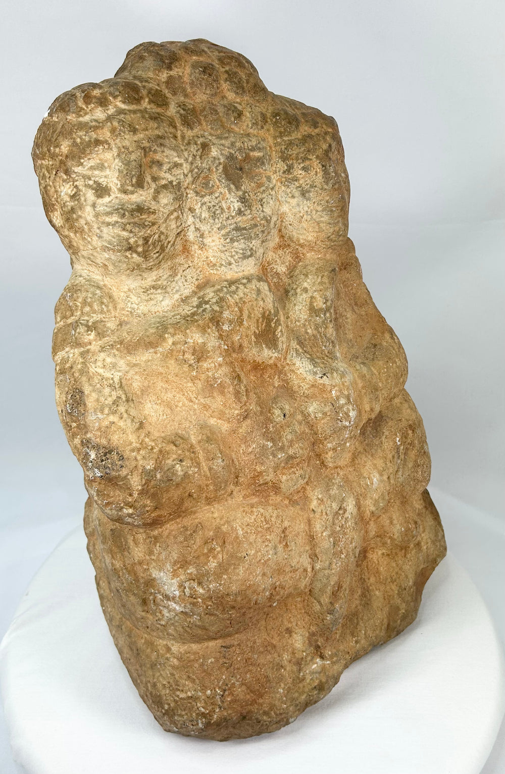 Side view of Majapahit three-faced Brahma stone sculpture, 14th–15th century Java, Indonesia, carved from volcanic andesite with natural patina and temple wear.