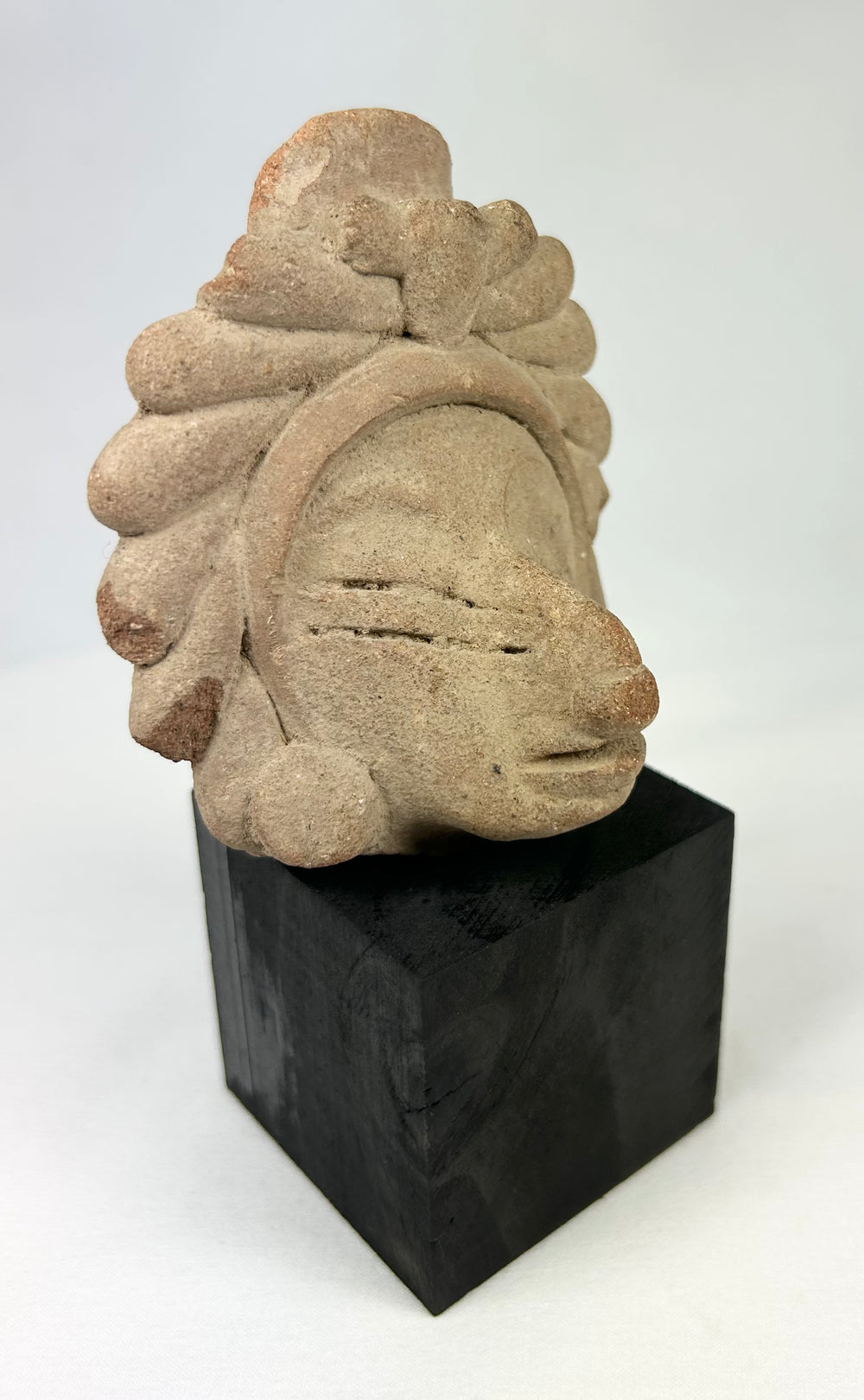 Javanese Majapahit temple fragment, Kala Simha guardian head carving with stylized radiating mane