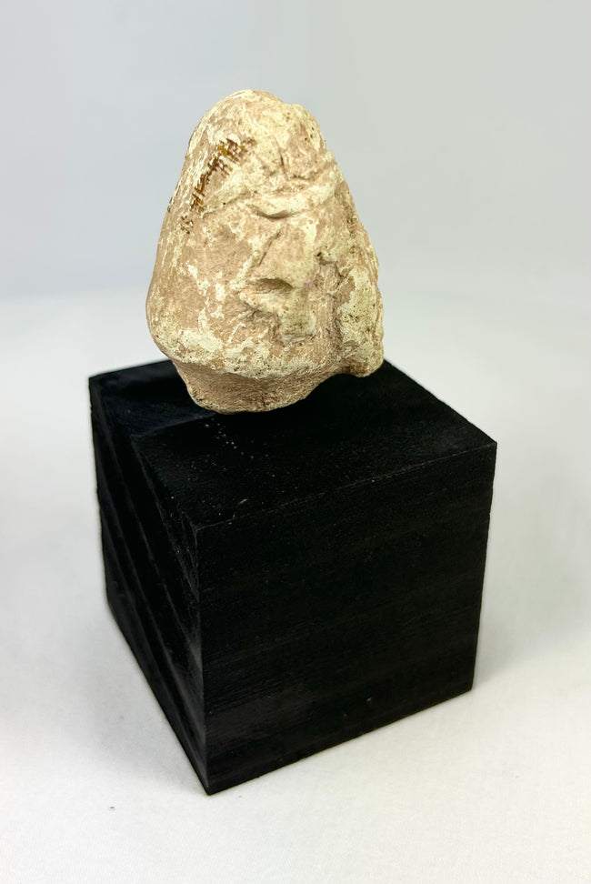 Ancient Near East stone idol head, carved votive fragment with almond eyes and simplified facial features