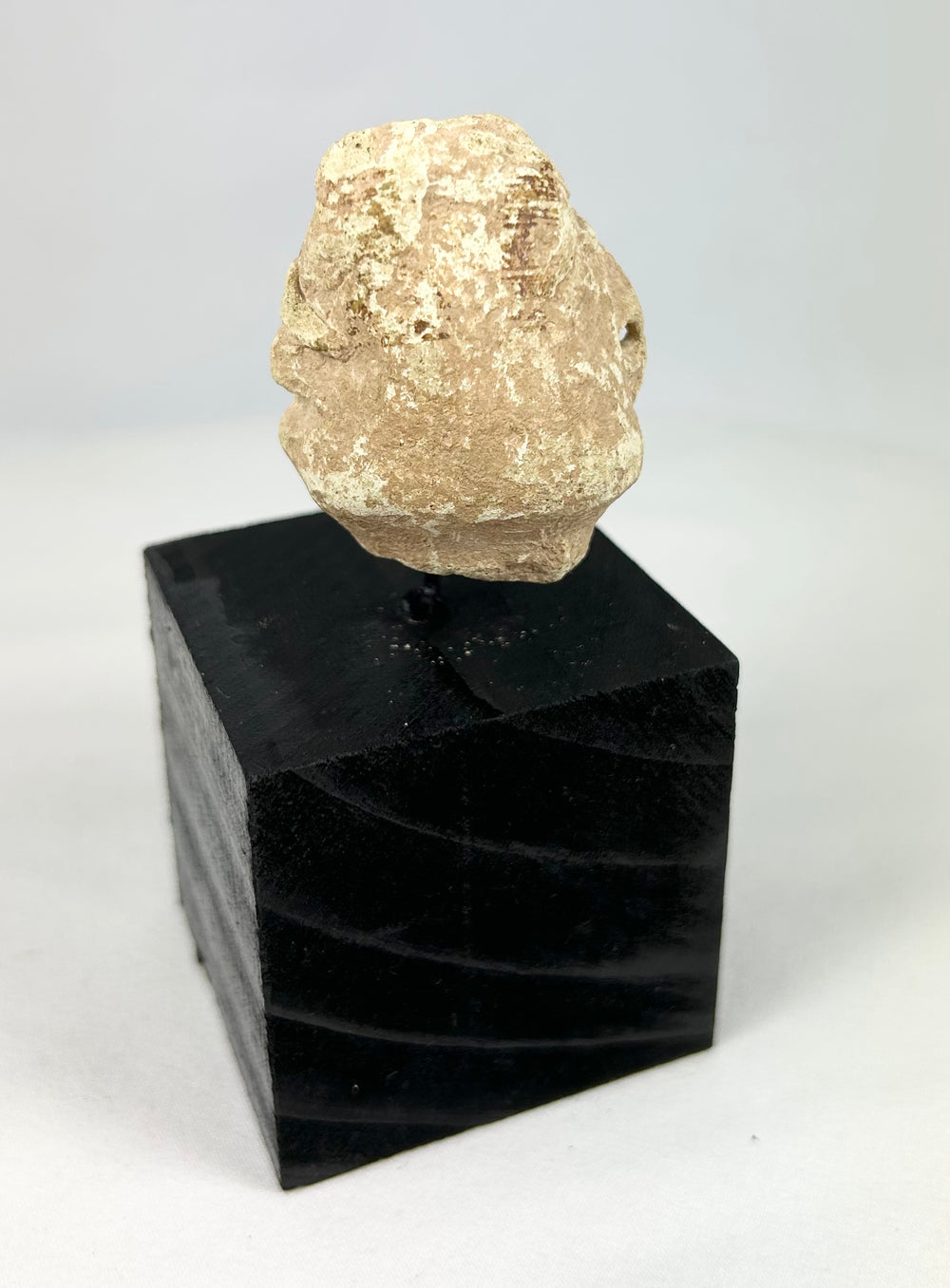 Early Mesopotamian votive stone head fragment with broad nose and incised almond-shaped eyes