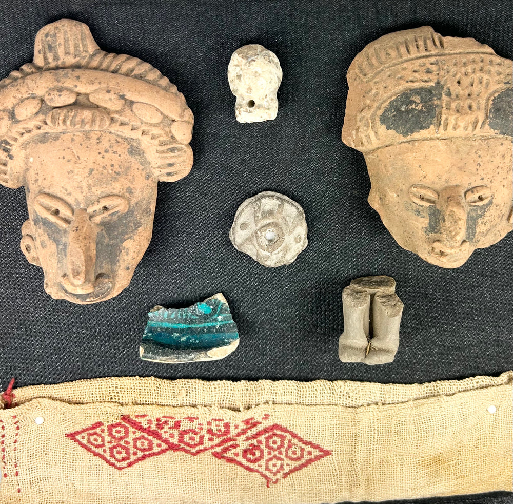 Pre-Columbian terracotta fragments and red geometric textile, framed in shadowbox for display