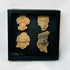 Ancient terracotta face fragments with expressive features, Pre-Columbian display