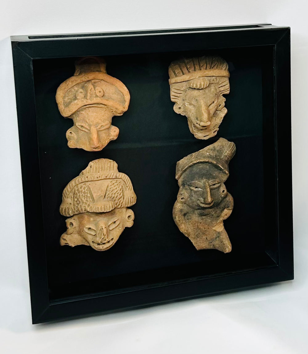 Framed display of four ancient terracotta masks, Pre-Columbian Mesoamerican art