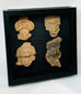 Framed display of four ancient terracotta masks, Pre-Columbian Mesoamerican art