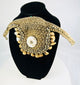 Antique Melanesian ceremonial ornament featuring cowrie shell and woven fiber base