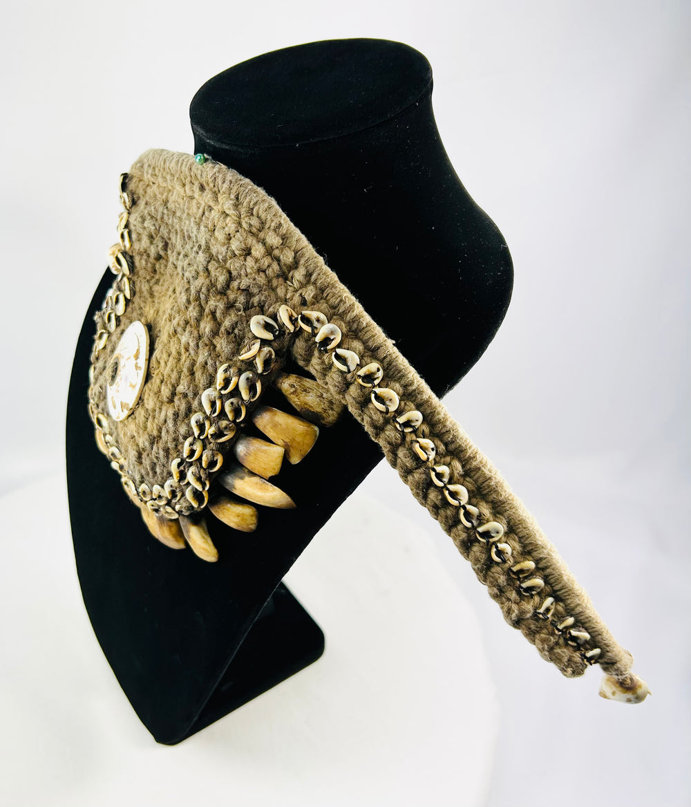 Late 19th–early 20th century Melanesian ceremonial adornment, woven fiber, cowrie shell, animal teeth