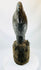 Hand-carved West African figure with subtle organic pigment traces and fiber-wrapped torso