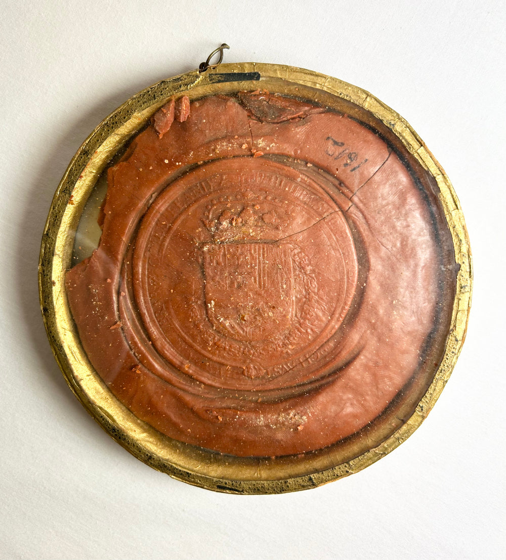 Historic red wax seal of Philip IV featuring throne scene and inscription