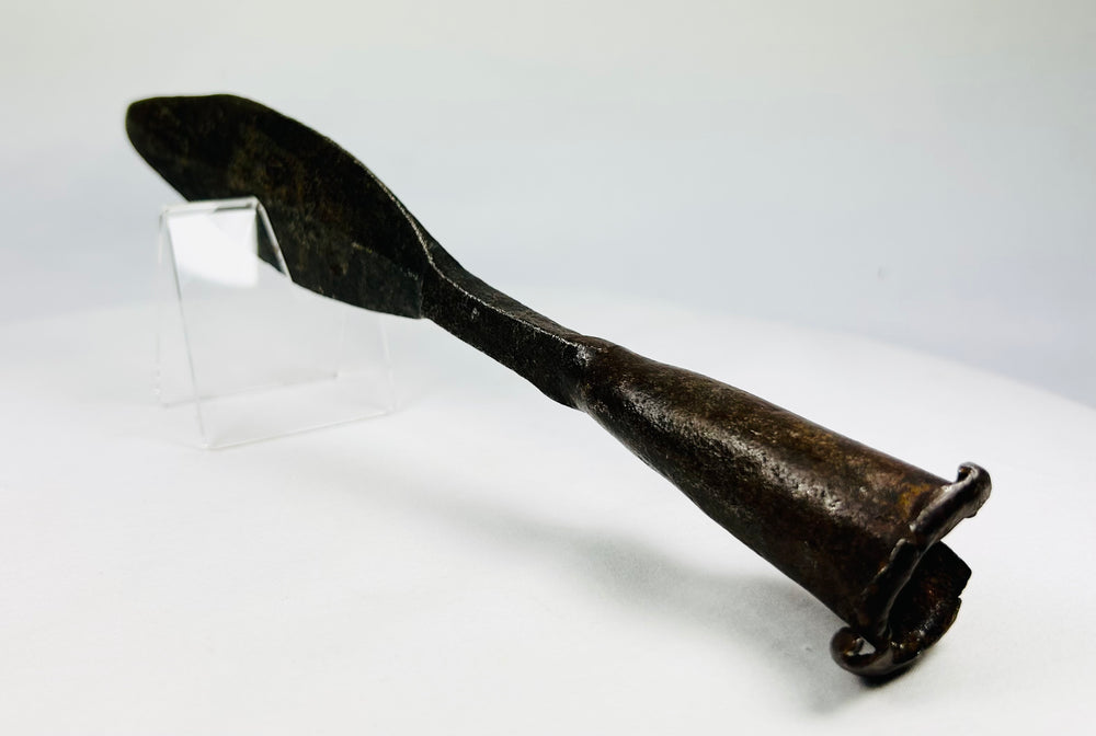 Antique iron spearhead showing natural patina and historic wear