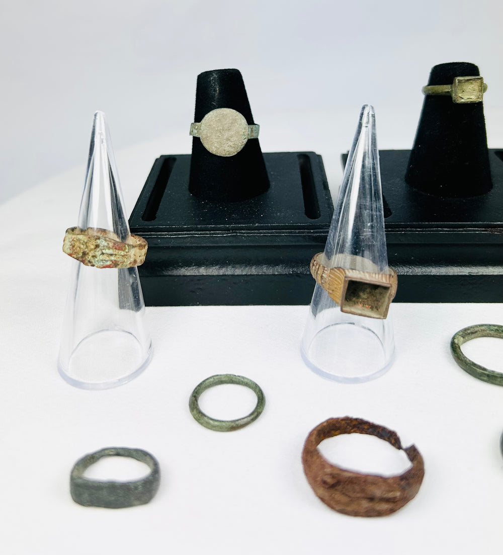Collection of antique bronze rings with diverse patinas and signet bezels