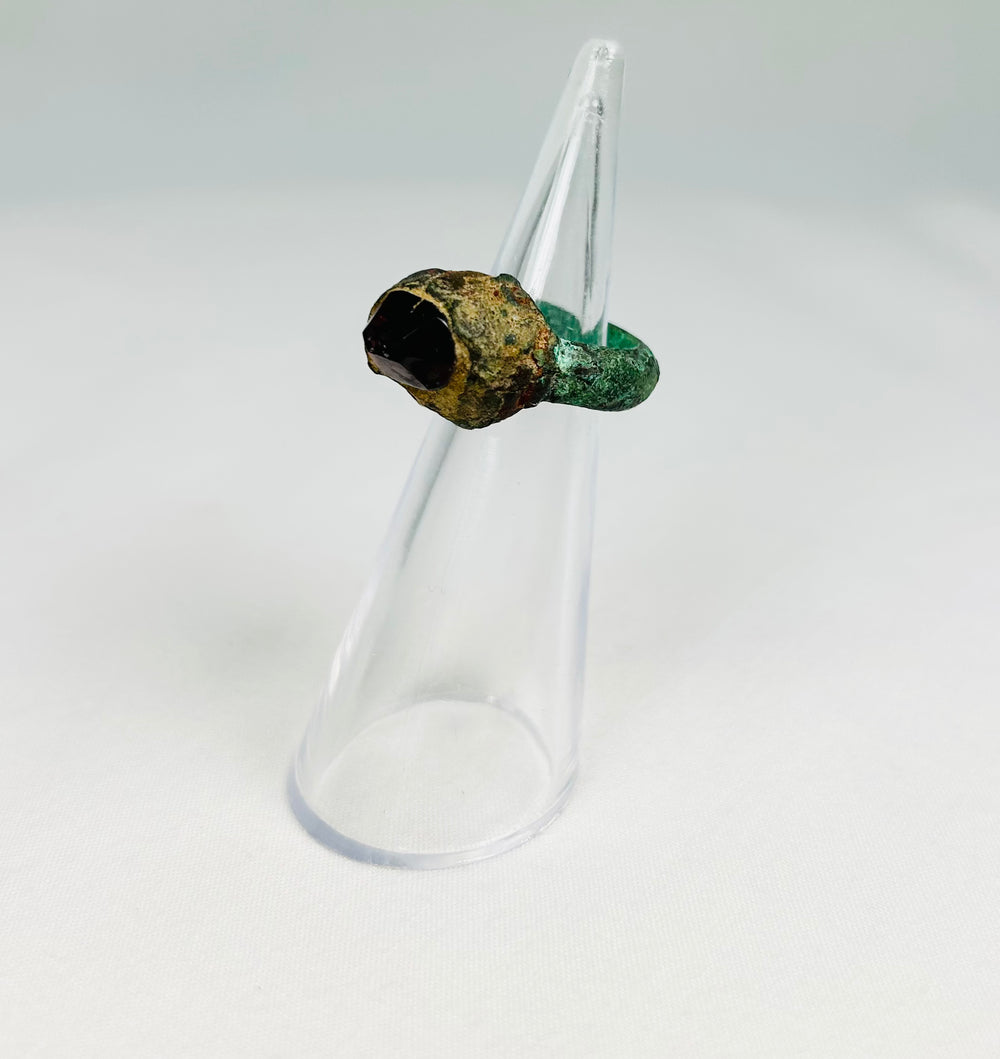 9th–7th century BCE Assyrian bronze ring with raised gemstone bezel